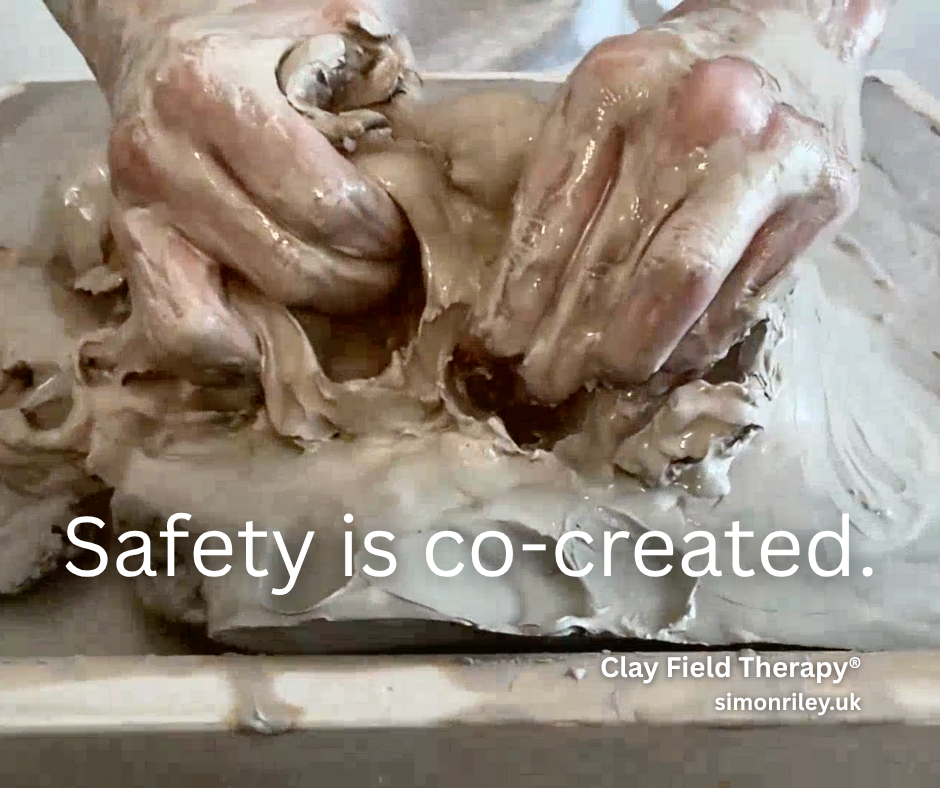 Child’s hands exploring clay during Clay Field Therapy®