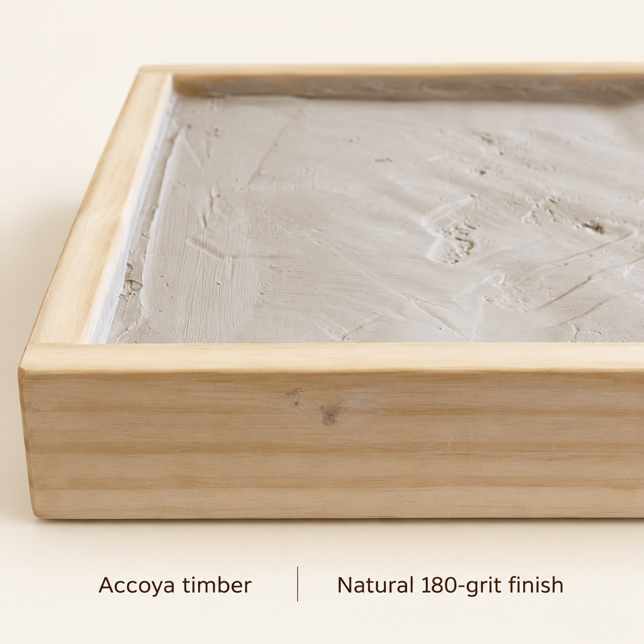 Close-up of the Accoya timber grain and finished rim, labelled natural 180-grit finish.